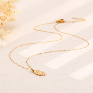 Vintage portrait oval pendant necklace in gold finish with elegant floral background