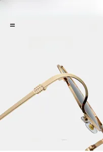 Close-up of golden metal double bridge sunglasses hinges showing durable elastic texture