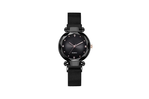 Detailed macro view of geometric cut glass dial with crystal markers on black quartz watch