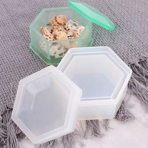 Detail of hexagon silicone resin mold with a finished green storage box and shells
