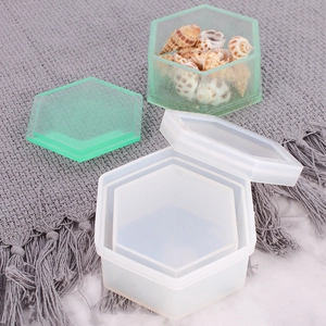 Detailed view of hexagonal silicone mold with a translucent green resin storage box