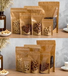 Detail of kraft paper stand-up pouches with transparent window on a wooden table