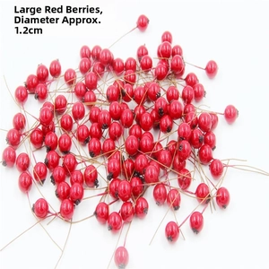 Macro shot of 1.2cm red artificial berries for DIY Christmas wreaths and decorations
