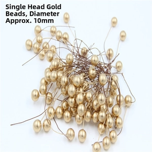 Detail of 10mm golden artificial berries with flexible brown wire for DIY crafts