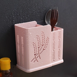 Pink wall-mounted plastic utensil holder with hollow wheat pattern and double compartments