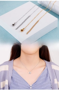 Detail of lobster clasp and adjustable chain on minimalist heart pendant necklace