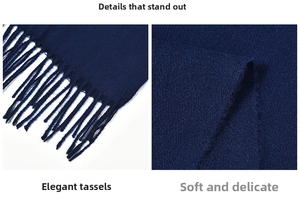 Close-up of deep blue cashmere-like scarf showing soft texture and tassel detail