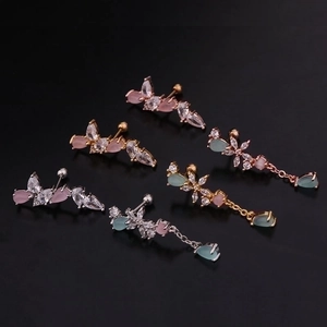 Golden and silver flower butterfly stud earrings set with colorful zircon on black background