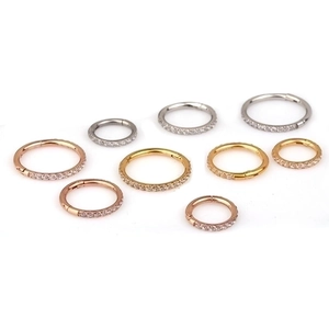 Surgical steel segment rings with side-set cubic zirconia in rose gold, gold and silver