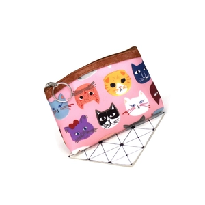 Detail of pink cartoon cat coin purse showing durable fabric and silver metal keychain ring
