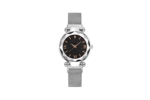 Detailed close-up of multifaceted glass dial with black starry sky pattern and silver mesh band