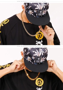 Close-up of a chunky gold stainless steel hip-hop necklace chain worn by a male model