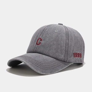 Detail of red 1999 embroidery on vintage washed grey denim baseball cap side