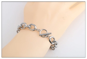 Silver stainless steel OT toggle clasp link chain bracelet shown on a model hand