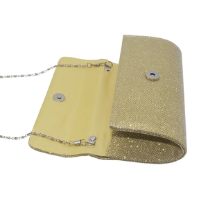 Inside view of sparkly gold clutch bag showing magnetic buckle and silver metal chain
