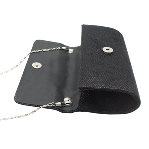 Detail of black sequined evening bag interior with silver magnetic buckle and chain
