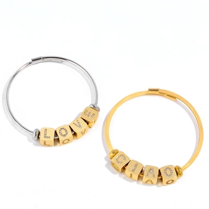 Polished gold and silver bracelets with LOVE and CIAO rhinestone letter cubes