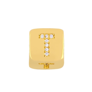 Macro detail of 18K gold plated square charm with crystal pave letter T initial