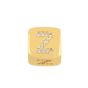 Detailed shot of golden alphabet Z charm bead with shimmering pavé crystal inlay