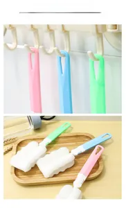 Detail of long handle sponge brushes in three colors with hanging holes for storage