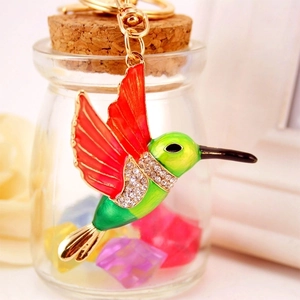 Chic hummingbird keychain with colorful enamel and sparkling rhinestones on golden metal