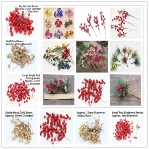 Golden and red artificial berries for Christmas wreaths and DIY tree decorations