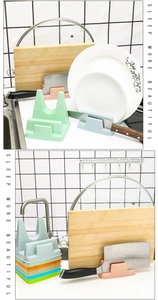 Multi-functional colorful kitchen rack holding a knife, cutting board, and pot lid by the sink