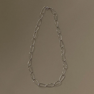 Detail of 925 sterling silver chunky link choker with large oval rings and toggle clasp