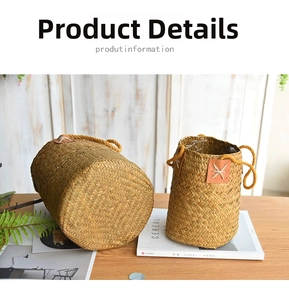 Close-up of natural woven straw storage baskets with brown leather patch and rope handles