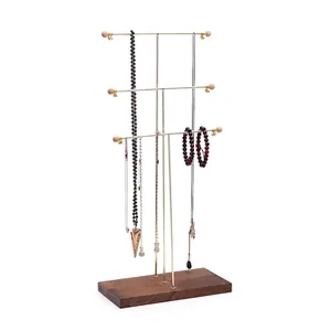 Three-tier gold metal necklace display stand with multi-hooks and solid wood base