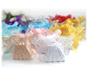 Laser-cut butterfly favor boxes with satin ribbons for wedding candy packaging