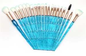 Detail view of 20pcs makeup brushes with glitter blue handles and rose gold ferrules