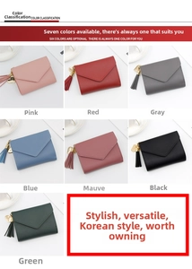 Detail of multi-color PU leather envelope wallets with tassel and heart pendants