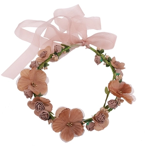 Detailed view of handmade brown rose floral wreath headband with realistic fabric petals