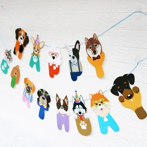 Dog happy birthday banner featuring cute cartoon dog head cards on a white wall
