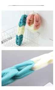 Macro detail of tricolor mesh back scrubber with dense texture and hanging ropes