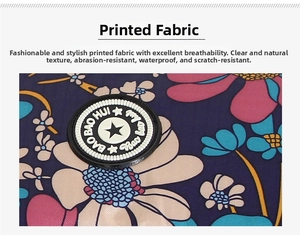Close-up of floral printed waterproof fabric with BAO BAO HUI circular logo patch