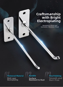 Detail of silver plated wall-mounted hooks with dual-hole base and smooth spherical ends