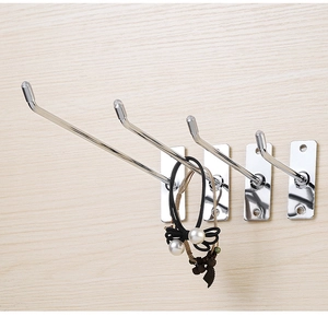 Detail of four silver metal wall hooks in various lengths for retail display and storage