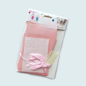 Pink 12-month photo banner set with ribbons for baby first birthday party decoration