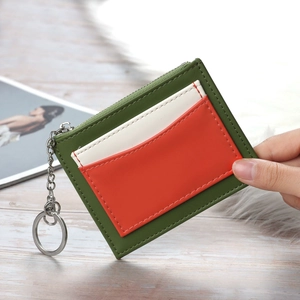 Women's minimalist tri-color leather card holder with secure metal zipper and keychain