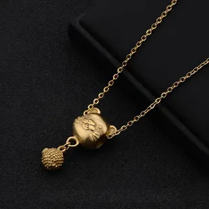 Detailed close-up of a gold-plated mouse pendant on a titanium steel cross chain
