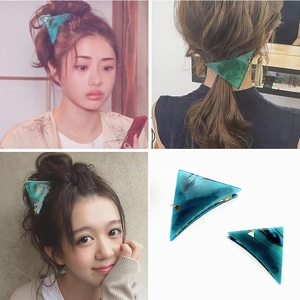 Set of two green marble textured triangle hair clips with gold accents for women