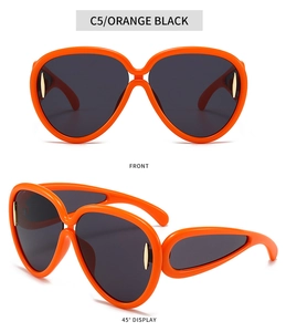 Détails de lunettes de soleil orange oversize avec verres gris et accents dorés