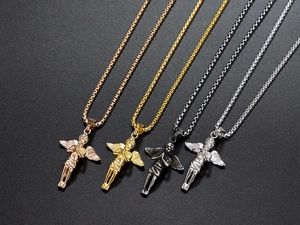 Detailed view of angel necklaces in rose gold, gold, black, and silver finishes