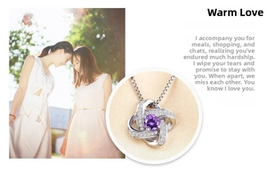 Macro view of S925 silver clover necklace with purple gem and diamond-set spiral pendant