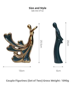 Detailed close-up of dark green and gold plated abstract ceramic couple sculpture set
