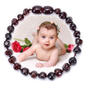 Irregular deep red cherry amber beaded baby bracelet with secure hand-knotted design