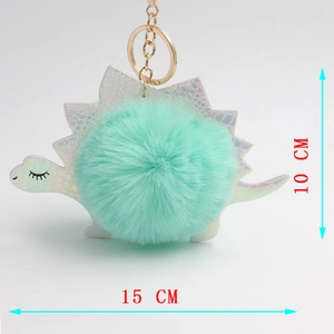 Dettaglio dimensioni del portachiavi dinosauro peluche con altezza 10cm e larghezza 15cm