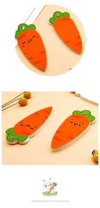 Detail of creative carrot-shaped magnetic bookmarks with cute cartoon expressions
